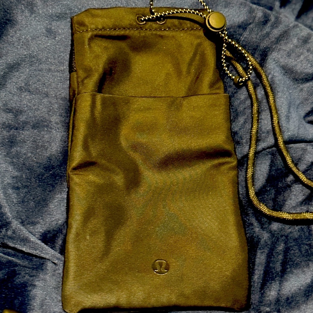Lululemon adjustable neck pouch. Black water resistant fabric.